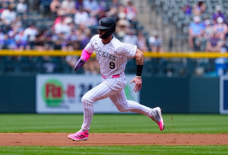 May 11, 2025; Denver, Colorado, USA; Colorado Rockies outfielder Brenton Doyle (9) advances to third in the first inning against the San Diego Padres at Coors Field. Mandatory Credit: Ron Chenoy-Imagn Images