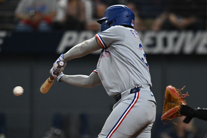 Sep 26, 2025; Cleveland, Ohio, USA; Texas Rangers second baseman Cody Freeman (39) hits an RBI single against the Cleveland Guardians during the seventh inning at Progressive Field. Mandatory Credit: Ken Blaze-Imagn Images