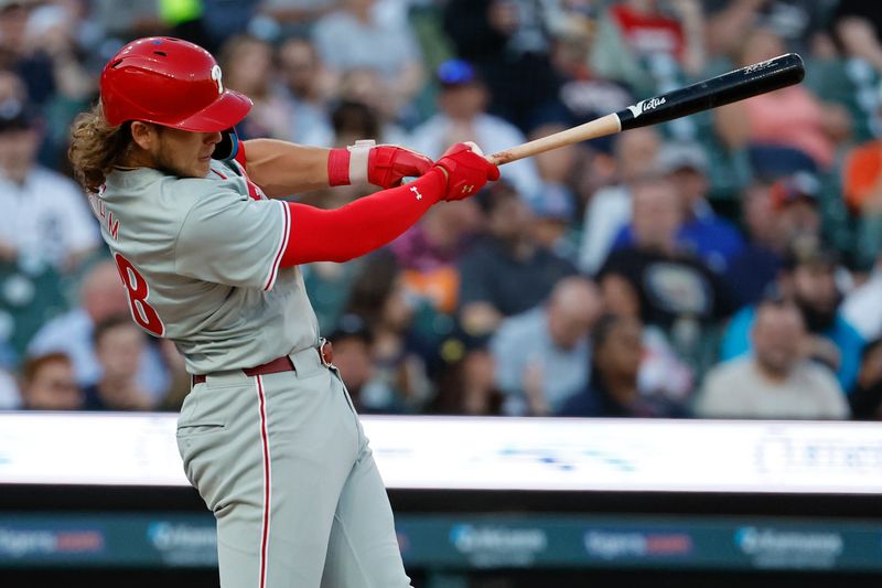 Jun 24, 2024; Detroit, Michigan, USA;  Philadelphia Phillies third baseman Alec Bohm (28) hits a single in the fifth inning against the Detroit Tigers at Comerica Park. Mandatory Credit: Rick Osentoski-USA TODAY Sports