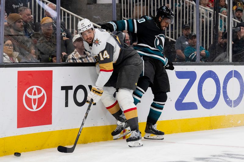 Feb 19, 2024; San Jose, California, USA; Vegas Golden Knights defenseman Nicolas Hague (14) is checked into the birds by San Jose Sharks left wing Anthony Duclair (10) during the second period at SAP Center at San Jose. Mandatory Credit: Neville E. Guard-USA TODAY Sports