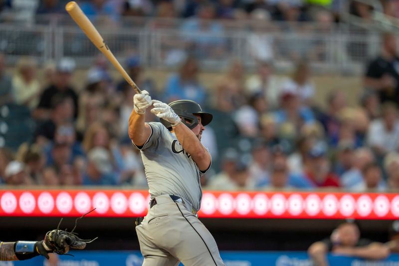 Aug 2, 2024; Minneapolis, Minnesota, USA; Chicago White Sox right fielder Dominic Fletcher (7) hits a single against the Minnesota Twins in the fifth inning at Target Field. Mandatory Credit: Jesse Johnson-USA TODAY Sports