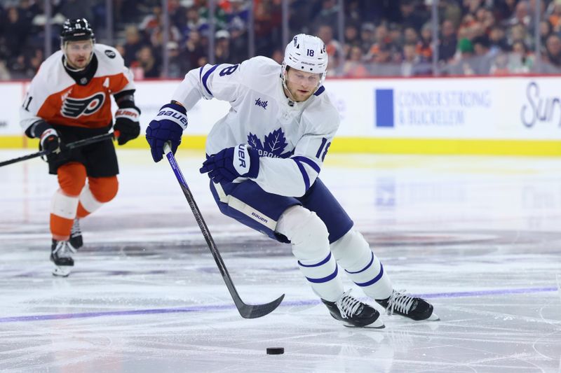 Jan 8, 2026; Philadelphia, Pennsylvania, USA; Toronto Maple Leafs center Steven Lorentz (18) controls the puck against the Philadelphia Flyers during the second period at Xfinity Mobile Arena. Mandatory Credit: Bill Streicher-Imagn Images