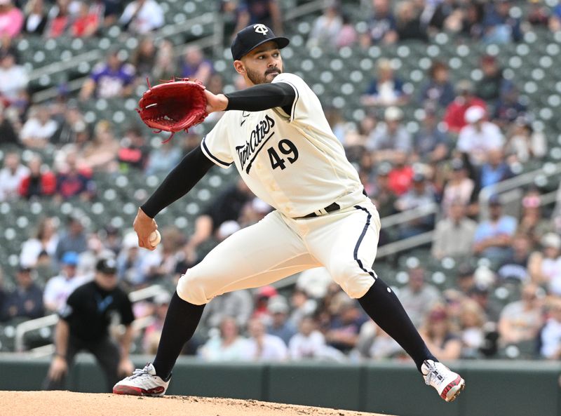 Sep 10, 2023; Minneapolis, Minnesota, USA; Minnesota Twins starting pitcher Pablo Lopez (49) delivers a pitch against the New York Mets in the second inning at Target Field. Mandatory Credit: Michael McLoone-USA TODAY Sports