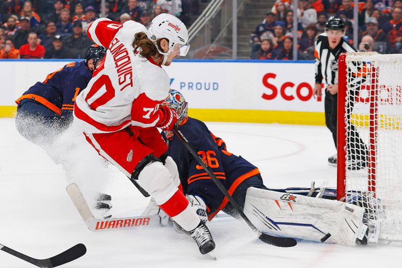 Feb 15, 2023; Edmonton, Alberta, CAN; Edmonton Oilers goaltender Jack Campbell (36) makes a save on Detroit Red Wings forward Oskar Sundqvist (70) during the second period at Rogers Place. Mandatory Credit: Perry Nelson-USA TODAY Sports