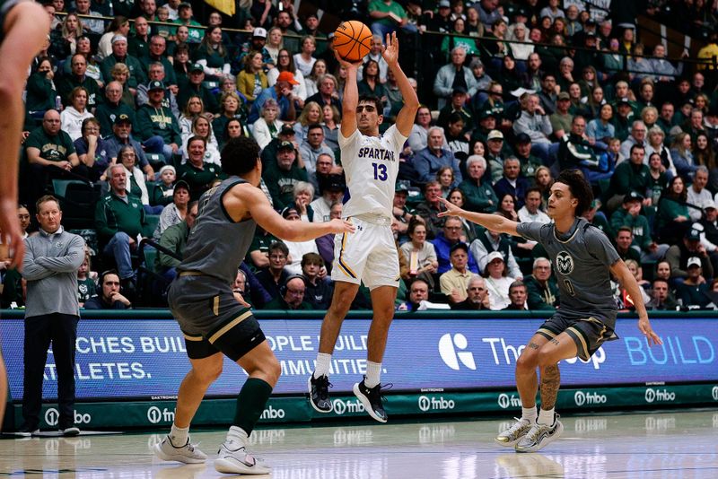 Feb 9, 2024; Fort Collins, Colorado, USA; San Jose State Spartans guard Alvaro Cardenas (13) attempts a shot against Colorado State Rams forward Joel Scott (1) and guard Kyan Evans (0) in the first half at Moby Arena. Mandatory Credit: Isaiah J. Downing-USA TODAY Sports