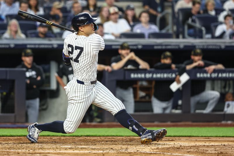 May 17, 2024; Bronx, New York, USA;  New York Yankees designated hitter Giancarlo Stanton (27) hits an RBI double in the fourth inning against the Chicago White Sox at Yankee Stadium. Mandatory Credit: Wendell Cruz-USA TODAY Sports