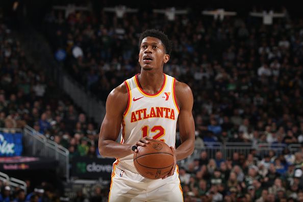 MILWAUKEE, WI - DECEMBER 2: De'Andre Hunter #12 of the Atlanta Hawks shoots a free throw during the game against the Milwaukee Bucks on December 2, 2023 at the Fiserv Forum Center in Milwaukee, Wisconsin. NOTE TO USER: User expressly acknowledges and agrees that, by downloading and or using this Photograph, user is consenting to the terms and conditions of the Getty Images License Agreement. Mandatory Copyright Notice: Copyright 2023 NBAE (Photo by Gary Dineen/NBAE via Getty Images).