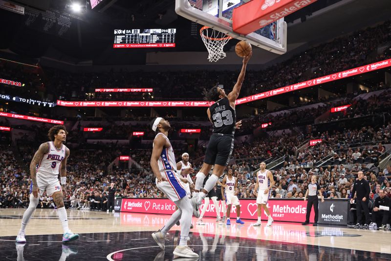 SAN ANTONIO, TX - APRIL 7: Tre Jones #33 of the San Antonio Spurs drives to the basket during the game against the Philadelphia 76ers on April 7, 2024 at the Frost Bank Center in San Antonio, Texas. NOTE TO USER: User expressly acknowledges and agrees that, by downloading and or using this photograph, user is consenting to the terms and conditions of the Getty Images License Agreement. Mandatory Copyright Notice: Copyright 2024 NBAE (Photos by Tim Heitman/NBAE via Getty Images)