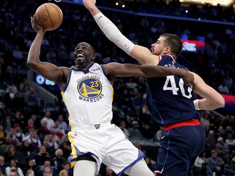 INGLEWOOD, CALIFORNIA - NOVEMBER 18: Draymond Green #23 of the Golden State Warriors reacts as he attempts a shot on Ivica Zubac #40 of the LA Clippers during a 102-99 Clippers win at Intuit Dome on November 18, 2024 in Inglewood, California. (Photo by Harry How/Getty Images) NOTE TO USER: User expressly acknowledges and agrees that, by downloading and or using this photograph, User is consenting to the terms and conditions of the Getty Images License Agreement.  (Photo by Harry How/Getty Images)