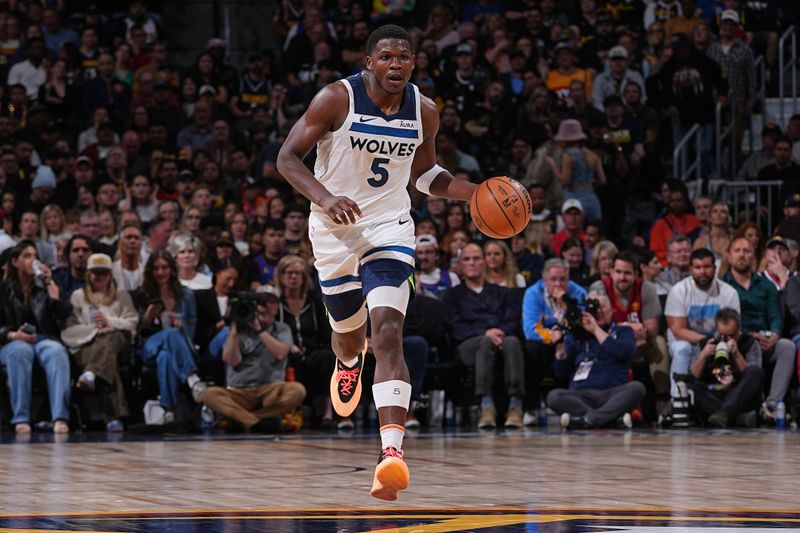 DENVER, CO - APRIL 10: Anthony Edwards #5 of the Minnesota Timberwolves dribbles the ball during the game against the Denver Nuggets on April 10, 2024 at the Ball Arena in Denver, Colorado. NOTE TO USER: User expressly acknowledges and agrees that, by downloading and/or using this Photograph, user is consenting to the terms and conditions of the Getty Images License Agreement. Mandatory Copyright Notice: Copyright 2024 NBAE (Photo by Bart Young/NBAE via Getty Images)