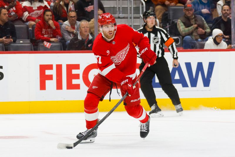 Nov 2, 2024; Detroit, Michigan, USA; Detroit Red Wings left wing J.T. Compher (37) handles the puck during the first period of the game against the Buffalo Sabres at Little Caesars Arena. Mandatory Credit: Brian Bradshaw Sevald-Imagn Images