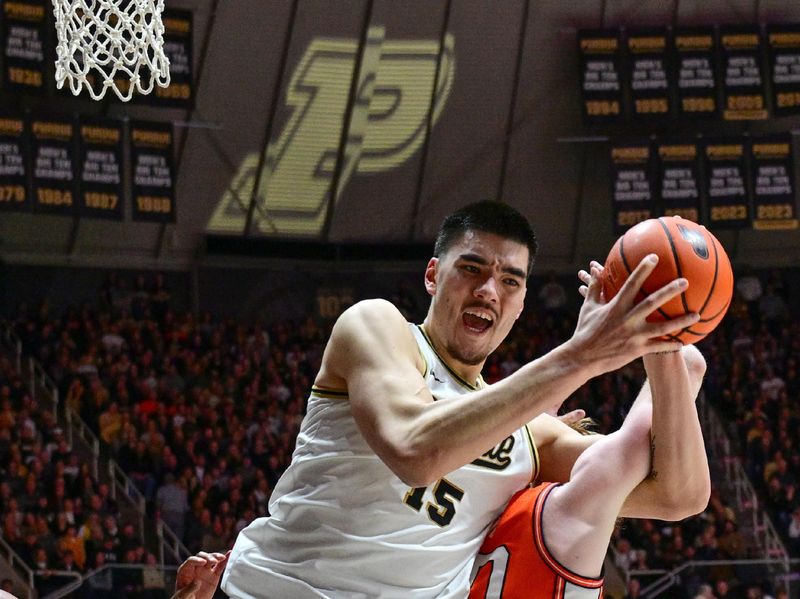 Jan 5, 2024; West Lafayette, Indiana, USA; Purdue Boilermakers center Zach Edey (15) grabs a rebound from Illinois Fighting Illini guard Luke Goode (10) during the second half at Mackey Arena. Mandatory Credit: Marc Lebryk-USA TODAY Sports