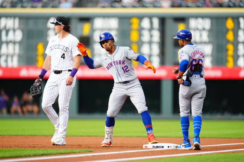 Aug 7, 2024; Denver, Colorado, USA; New York Mets shortstop Francisco Lindor (12) celebrates his single in the first inning against the Colorado Rockies at Coors Field. Mandatory Credit: Ron Chenoy-USA TODAY Sports