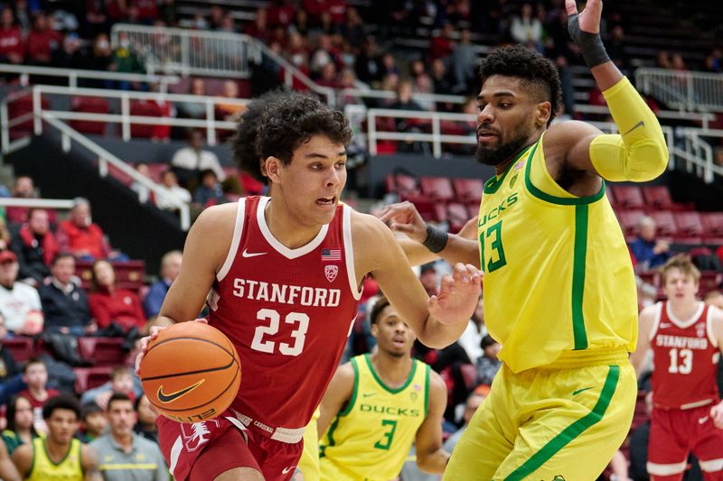 Jan 21, 2023; Stanford, California, USA; Stanford Cardinal forward Brandon Angel (23) drives to the basket against Oregon Ducks forward Quincy Guerrier (13) during the first half at Maples Pavilion. Mandatory Credit: Robert Edwards-USA TODAY Sports