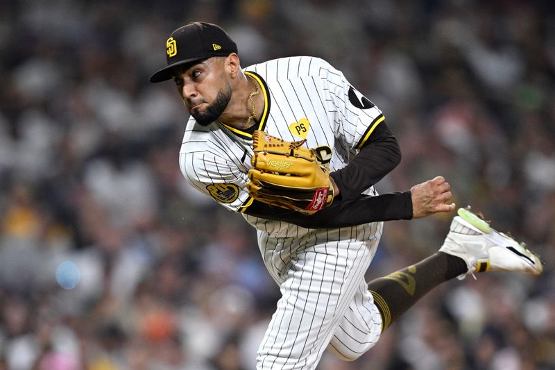 Aug 12, 2024; San Diego, California, USA; San Diego Padres relief pitcher Robert Suarez (75) pitches against the Pittsburgh Pirates during the ninth inning at Petco Park. Mandatory Credit: Orlando Ramirez-USA TODAY Sports