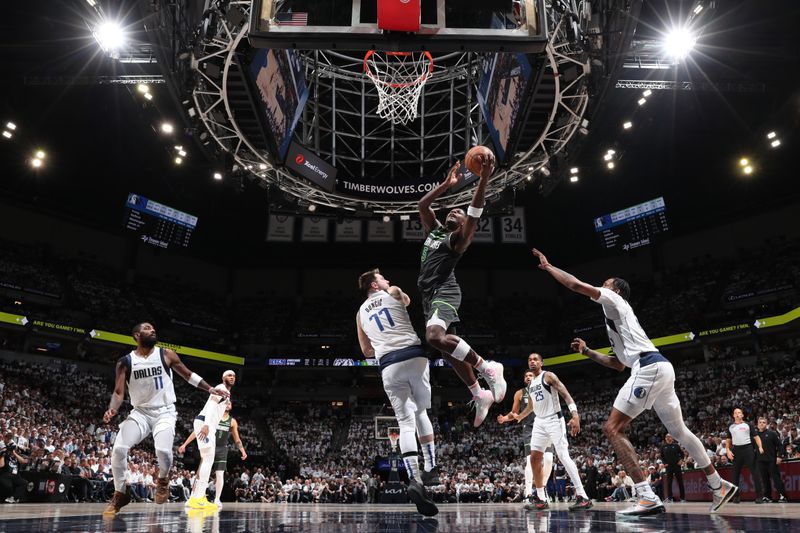 MINNEAPOLIS, MN - MAY 30: Anthony Edwards #5 of the Minnesota Timberwolves drives to the basket during the game against the Dallas Mavericks during Round 3 Game 5 of the 2024 NBA Playoffs on May 30, 2024 at Target Center in Minneapolis, Minnesota. NOTE TO USER: User expressly acknowledges and agrees that, by downloading and or using this Photograph, user is consenting to the terms and conditions of the Getty Images License Agreement. Mandatory Copyright Notice: Copyright 2024 NBAE (Photo by Joe Murphy/NBAE via Getty Images)