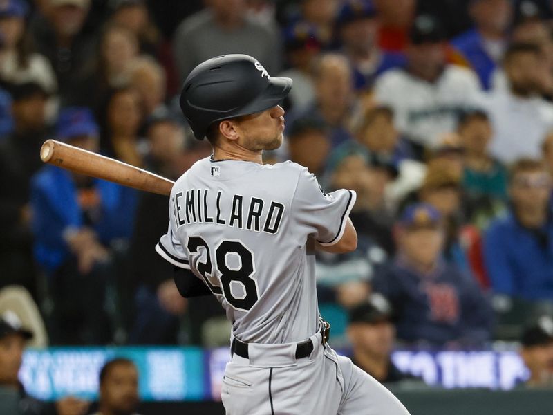 Jun 17, 2023; Seattle, Washington, USA; Chicago White Sox second bas Zach Remillard (28) hits an RBI-single against the Seattle Mariners during the ninth inning at T-Mobile Park. Mandatory Credit: Joe Nicholson-USA TODAY Sports