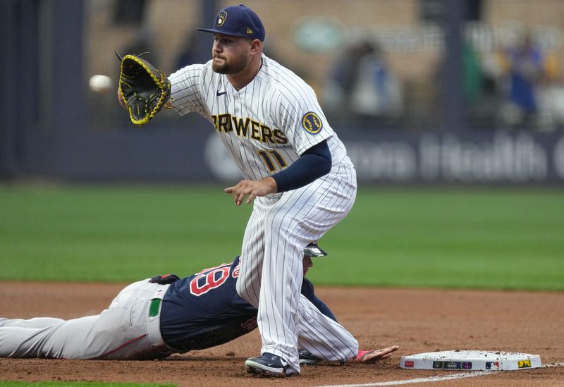 Apr 23, 2023; Milwaukee, Wisconsin, USA; Boston Red Sox right fielder Alex Verdugo (99) beats a pick off throw to Milwaukee Brewers first baseman Rowdy Tellez (11) during the first inning at American Family Field. Mandatory Credit: Mark Hoffman-USA TODAY Sports