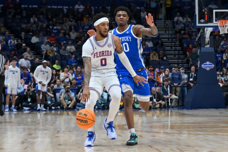 Mar 13, 2026; Nashville, TN, USA;  Florida Gators guard Boogie Fland (0) dribbles the ball past Kentucky Wildcats guard Otega Oweh (00) during the first half at Bridgestone Arena. Mandatory Credit: Steve Roberts-Imagn Images