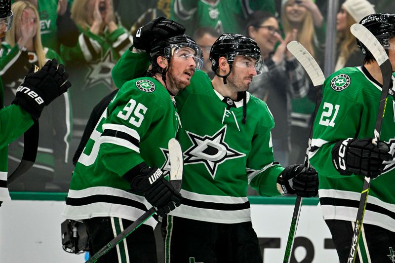 Dec 21, 2023; Dallas, Texas, USA; Dallas Stars defenseman Joel Hanley (44) hugs center Matt Duchene (95) after Duchene scores the game winning goal against the Vancouver Canucks during the overtime period at the American Airlines Center. Mandatory Credit: Jerome Miron-USA TODAY Sports