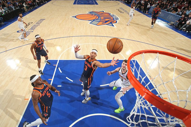 NEW YORK, NY - JANUARY 25: Josh Hart #3 of the New York Knicks rebounds during the game against the Denver Nuggets on January 25, 2024 at Madison Square Garden in New York City, New York.  NOTE TO USER: User expressly acknowledges and agrees that, by downloading and or using this photograph, User is consenting to the terms and conditions of the Getty Images License Agreement. Mandatory Copyright Notice: Copyright 2024 NBAE  (Photo by Nathaniel S. Butler/NBAE via Getty Images)