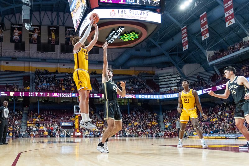 Jan 19, 2023; Minneapolis, Minnesota, USA; Minnesota Golden Gophers forward Jamison Battle (10) shoots over Purdue Boilermakers guard Ethan Morton (25) in the first half at Williams Arena. Mandatory Credit: Matt Blewett-USA TODAY Sports