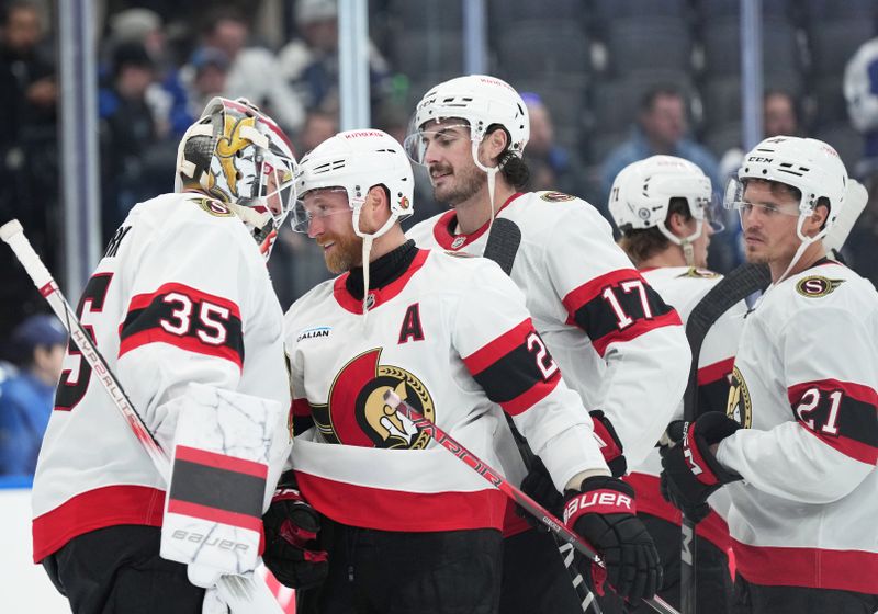 Nov 12, 2024; Toronto, Ontario, CAN; Ottawa Senators right wing Claude Giroux (28) celebrates a win with goaltender Linus Ullmark (35) against the Toronto Maple Leafs at Scotiabank Arena. Mandatory Credit: Nick Turchiaro-Imagn Images