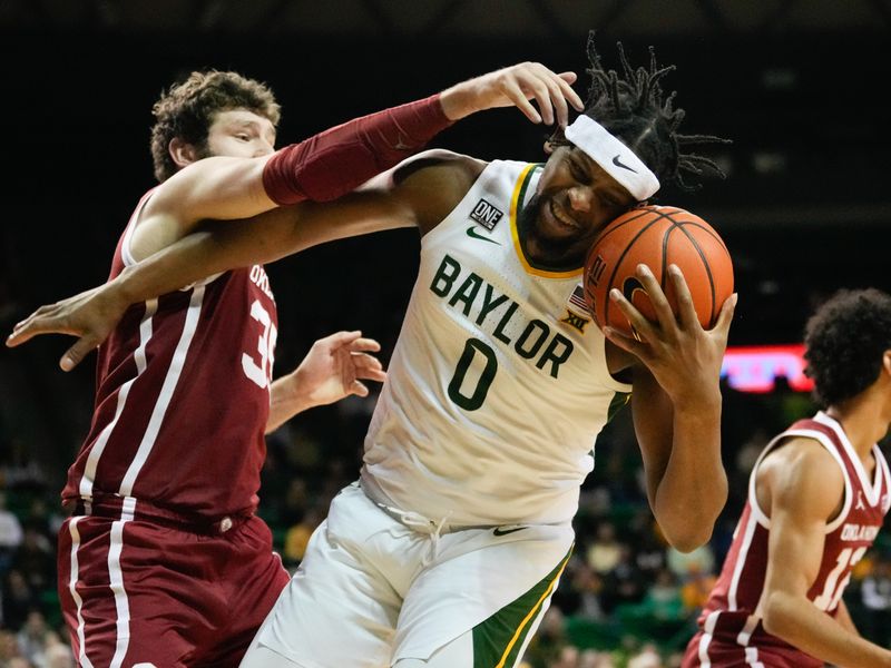 Feb 8, 2023; Waco, Texas, USA;  Baylor Bears forward Flo Thamba (0) grabs a rebound against Oklahoma Sooners forward Tanner Groves (35) during the first half at Ferrell Center. Mandatory Credit: Chris Jones-USA TODAY Sports