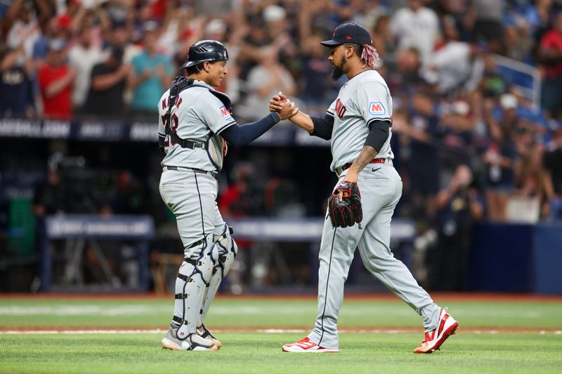 Jul 13, 2024; St. Petersburg, Florida, USA; Cleveland Guardians catcher Bo Naylor (23) and Cleveland Guardians pitcher Emmanuel Clase (48) celebrate after beating the Tampa Bay Rays at Tropicana Field. Mandatory Credit: Nathan Ray Seebeck-USA TODAY Sports