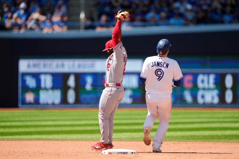 Jul 30, 2023; Toronto, Ontario, CAN; Los Angeles Angels second baseman Luis Rengifo (2) gets Toronto Blue Jays catcher Danny Jansen (9) out at second base on a force play during the eighth inning at Rogers Centre. Mandatory Credit: John E. Sokolowski-USA TODAY Sports