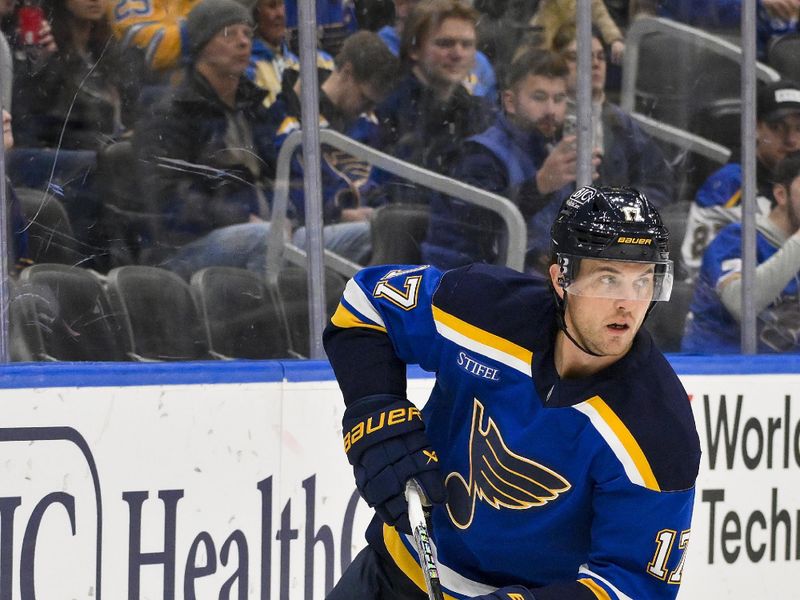 Jan 3, 2025; St. Louis, Missouri, USA;  St. Louis Blues defenseman Cam Fowler (17) controls the puck against the Ottawa Senators during the first period at Enterprise Center. Mandatory Credit: Jeff Curry-Imagn Images