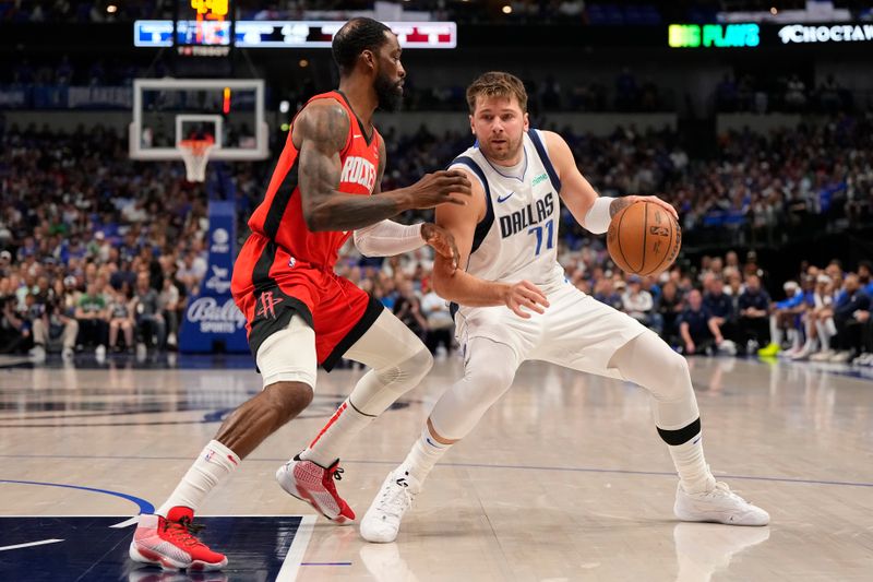 DALLAS, TEXAS - APRIL 07: Luka Doncic #77 of the Dallas Mavericks is defended by Jeff Green #32 of the Houston Rockets during the first half at American Airlines Center on April 07, 2024 in Dallas, Texas. NOTE TO USER: User expressly acknowledges and agrees that, by downloading and or using this photograph, User is consenting to the terms and conditions of the Getty Images License Agreement. (Photo by Sam Hodde/Getty Images)