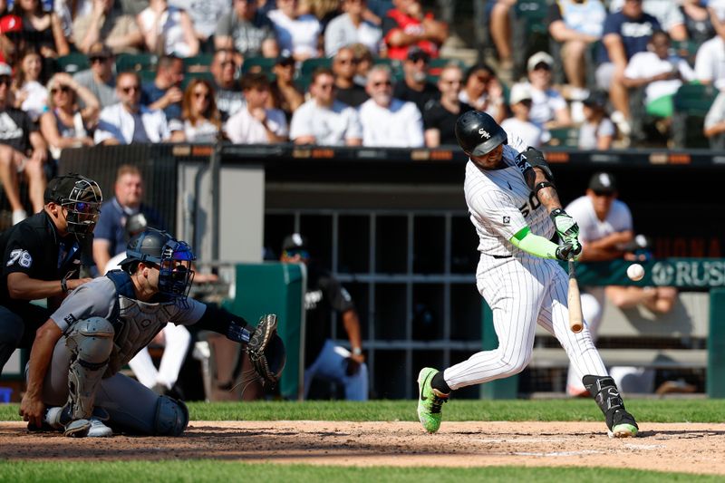 Aug 31, 2025; Chicago, Illinois, USA; Chicago White Sox first baseman Lenyn Sosa (50) hits a solo home run against the New York Yankees during the eight inning at Rate Field. Mandatory Credit: Kamil Krzaczynski-Imagn Images