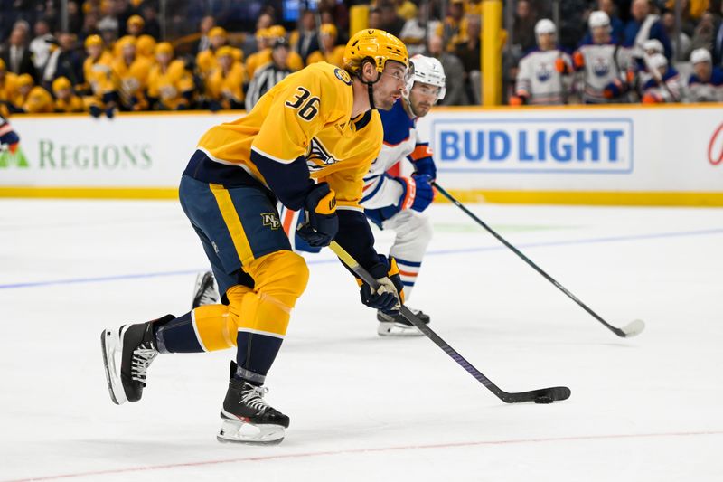 Oct 17, 2024; Nashville, Tennessee, USA;  Nashville Predators left wing Cole Smith (36) skates with the puck against the Edmonton Oilers during the first period at Bridgestone Arena. Mandatory Credit: Steve Roberts-Imagn Images