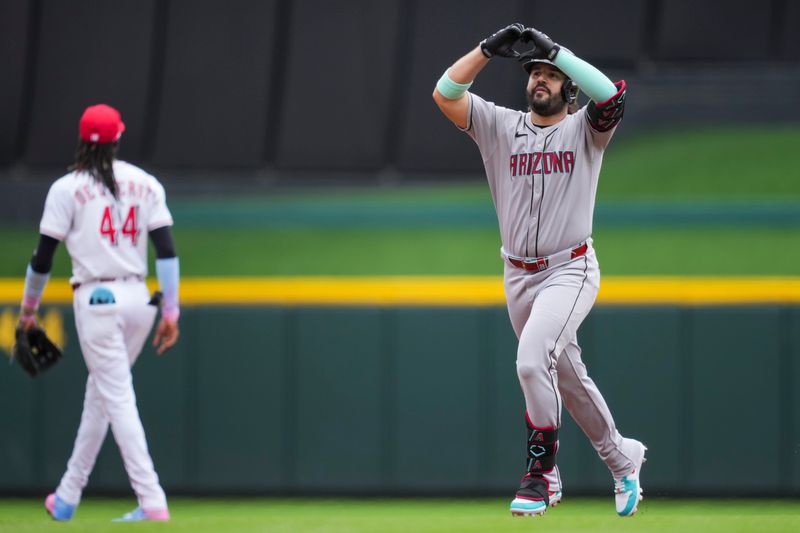 Jun 8, 2025; Cincinnati, Ohio, USA; Arizona Diamondbacks third base Eugenio Suarez (28) gestures as he runs the bases after hitting a solo home run against the Cincinnati Reds in the second inning at Great American Ball Park. Mandatory Credit: Aaron Doster-Imagn Images