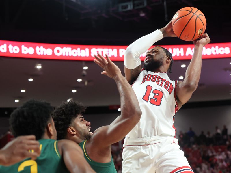 Feb 10, 2025; Houston, Texas, USA; Houston Cougars forward J'Wan Roberts (13) shoots against Baylor Bears forward Norchad Omier (15) in the first half at Fertitta Center. Mandatory Credit: Thomas Shea-Imagn Images