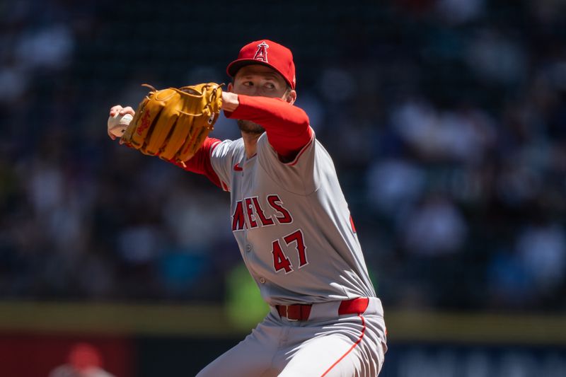 Jul 24, 2024; Seattle, Washington, USA;  Los Angeles Angels starter Griffin Canning (47) delivers a pitch during the first inning against the Seattle Mariners at T-Mobile Park. Mandatory Credit: Stephen Brashear-USA TODAY Sports