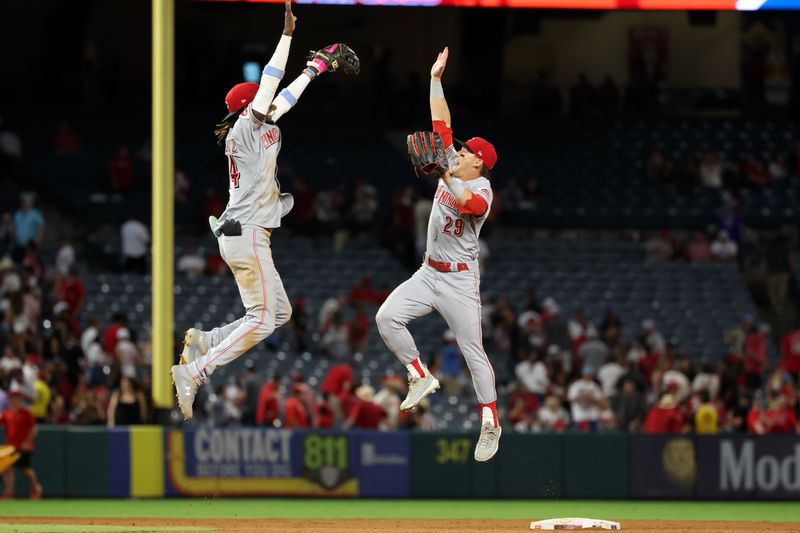 Aug 22, 2023; Anaheim, California, USA; Cincinnati Reds shortstop Elly De La Cruz (44) and center fielder TJ Friedl (29) celebrate a victory after defeating the Los Angeles Angels 4-3 at Angel Stadium. Mandatory Credit: Kiyoshi Mio-USA TODAY Sports