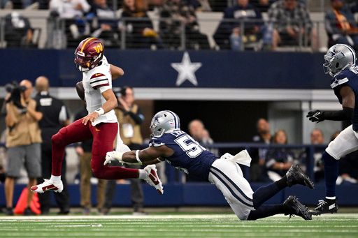 Washington Commanders quarterback Jayden Daniels (5) eludes the tackle of Dallas Cowboys defensive end Carl Lawson (55) as he runs with the ball during an NFL football game in Arlington, Texas, Sunday, Jan. 5, 2025. (AP Photo/Jerome Miron)