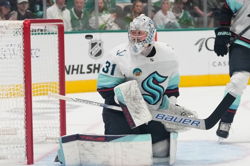 Oct 13, 2024; Dallas, Texas, USA;  Seattle Kraken goaltender Philipp Grubauer (31) makes a save against the Dallas Stars during the second period at American Airlines Center. Mandatory Credit: Chris Jones-Imagn Images