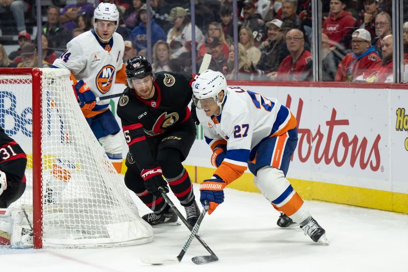 Nov 7, 2024; Ottawa, Ontario, CAN; New York Islanders left wing Anders Lee (27) battles with Ottawa Senators defenseman Jake Sanderson (85) for control of the puck in the second period at the Canadian Tire Centre. Mandatory Credit: Marc DesRosiers-Imagn Images