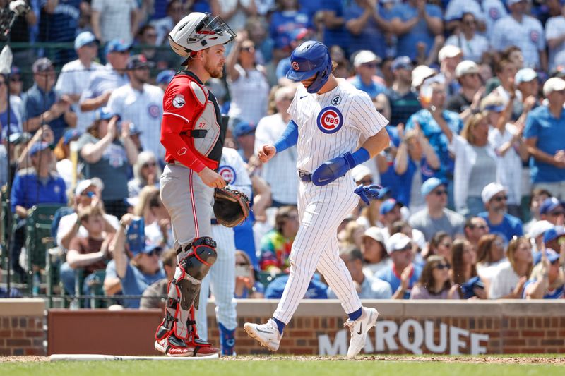 Jun 2, 2024; Chicago, Illinois, USA; Chicago Cubs second baseman Nico Hoerner (2) scores against the Cincinnati Reds during the fifth inning at Wrigley Field. Mandatory Credit: Kamil Krzaczynski-USA TODAY Sports