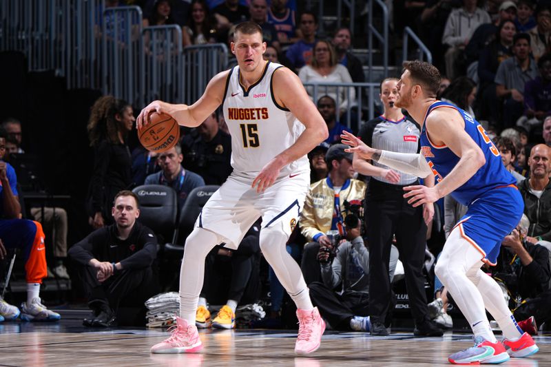 DENVER, CO - MARCH 21: Nikola Jokic #15 of the Denver Nuggets handles the ball during the game against the New York Knicks on March 21, 2024 at the Ball Arena in Denver, Colorado. NOTE TO USER: User expressly acknowledges and agrees that, by downloading and/or using this Photograph, user is consenting to the terms and conditions of the Getty Images License Agreement. Mandatory Copyright Notice: Copyright 2024 NBAE (Photo by Garrett Ellwood/NBAE via Getty Images)