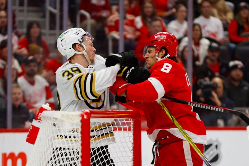 Dec 31, 2023; Detroit, Michigan, USA; Detroit Red Wings defenseman Ben Chiarot (8) scuffles with Boston Bruins center Morgan Geekie (39) during the first period of the game between the Boston Bruins and the Detroit Red Wings at Little Caesars Arena. Mandatory Credit: Brian Bradshaw Sevald-USA TODAY Sports