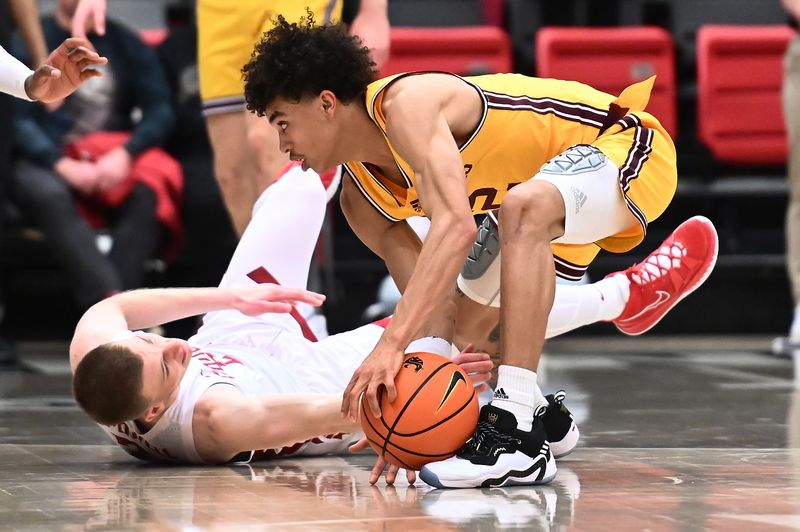 Jan 28, 2023; Pullman, Washington, USA; Arizona State Sun Devils guard Austin Nunez (2) grabs the ball against Washington State Cougars guard Justin Powell (24) in the second half at Friel Court at Beasley Coliseum. Washington State won 75-58. Mandatory Credit: James Snook-USA TODAY Sports