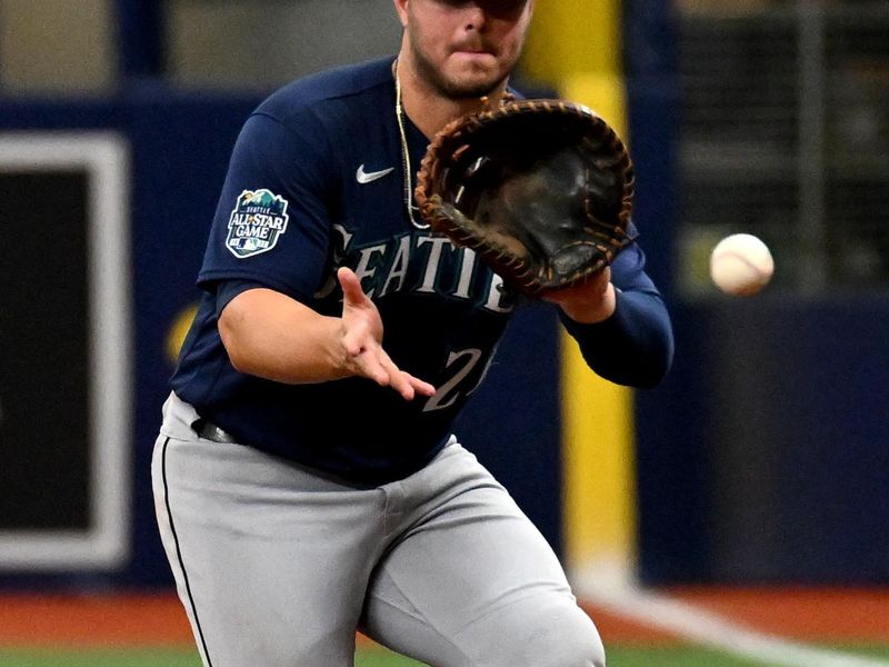 Sep 10, 2023; St. Petersburg, Florida, USA;  Seattle Mariners first baseman Ty France (23) fields a ground ball in the sixth inning against the Tampa Bay Rays at Tropicana Field. Mandatory Credit: Jonathan Dyer-USA TODAY Sports