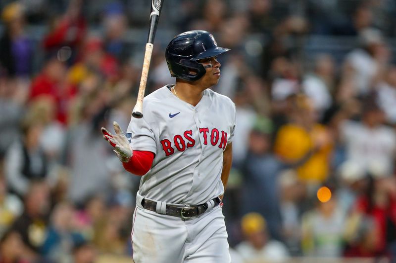 May 19, 2023; San Diego, California, USA;  Boston Red Sox third baseman Rafael Devers flips his bat after hitting his second home run of the game in third inning against the San Diego Padres at Petco Park. at Petco Park. Mandatory Credit: David Frerker-USA TODAY Sports