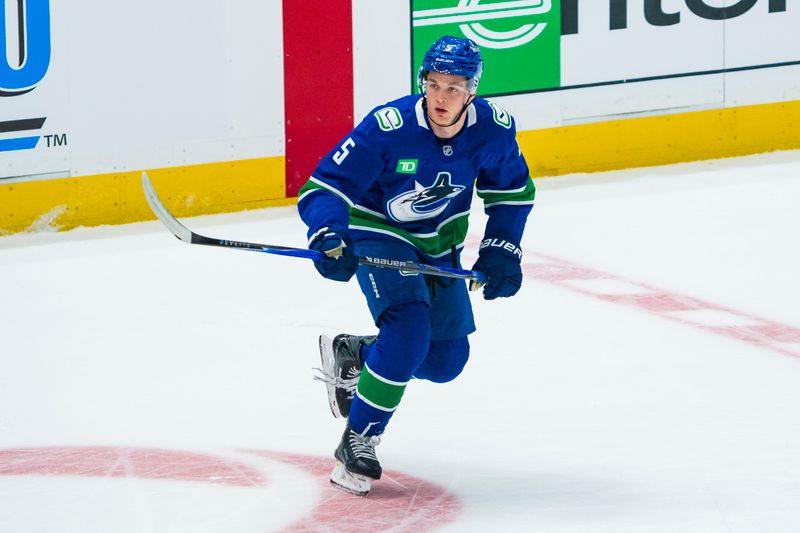 Sep 26, 2025; Vancouver, British Columbia, CAN; Vancouver Canucks defenseman Tom Willander (5) skates against the Seattle Kraken in the first period at Rogers Arena. Mandatory Credit: Bob Frid-Imagn Images