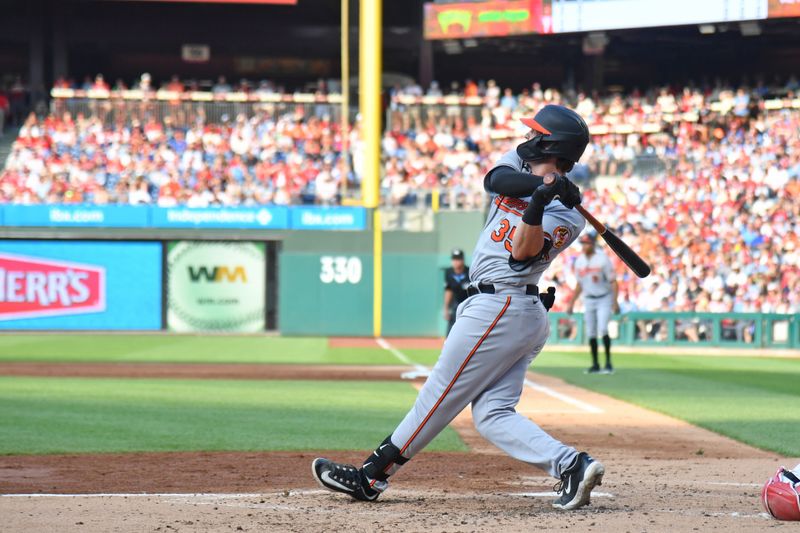 Jul 26, 2023; Philadelphia, Pennsylvania, USA; Baltimore Orioles catcher Adley Rutschman (35) hits a three run home run during the third inning against the Philadelphia Phillies at Citizens Bank Park. Mandatory Credit: Eric Hartline-USA TODAY Sports