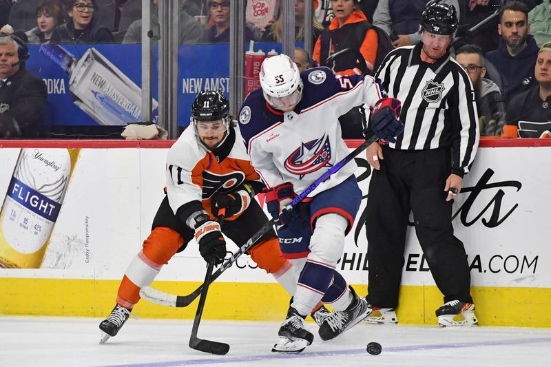 Jan 4, 2024; Philadelphia, Pennsylvania, USA; Philadelphia Flyers right wing Travis Konecny (11) and Columbus Blue Jackets defenseman David Jiricek (55) during the first period at Wells Fargo Center. Mandatory Credit: Eric Hartline-USA TODAY Sports